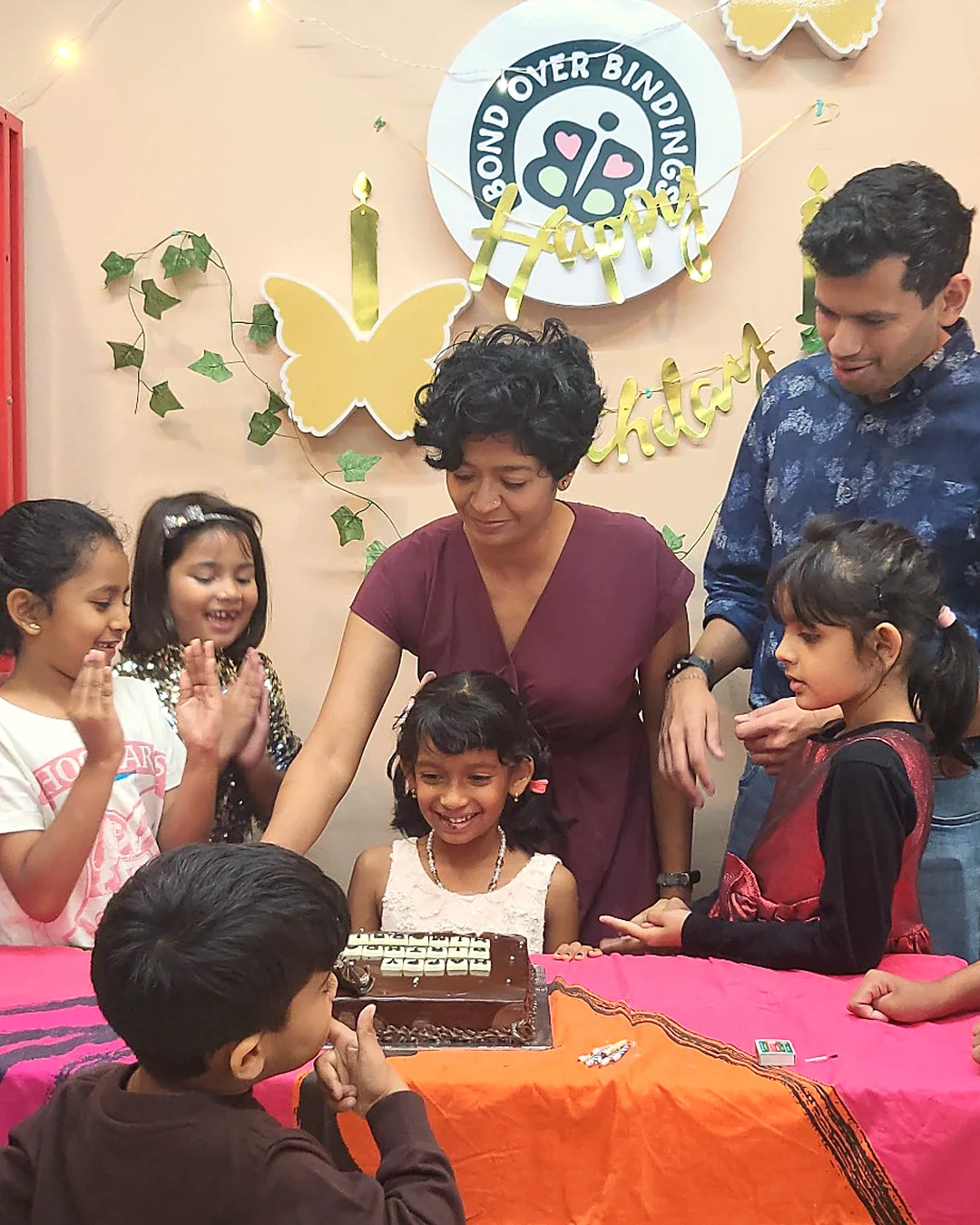 Family birthday cake moment at BOB
