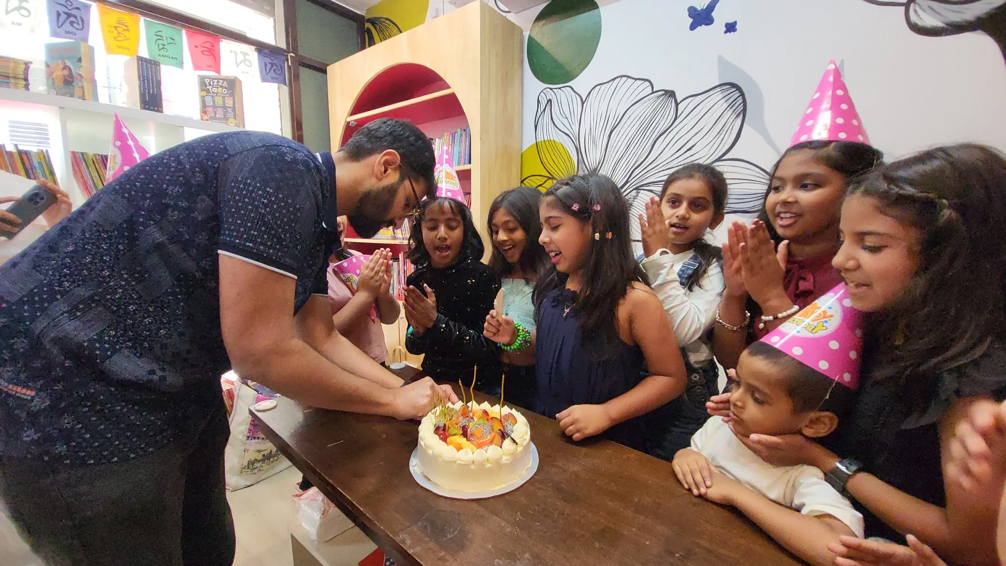 Cake-cutting birthday moment at BOB