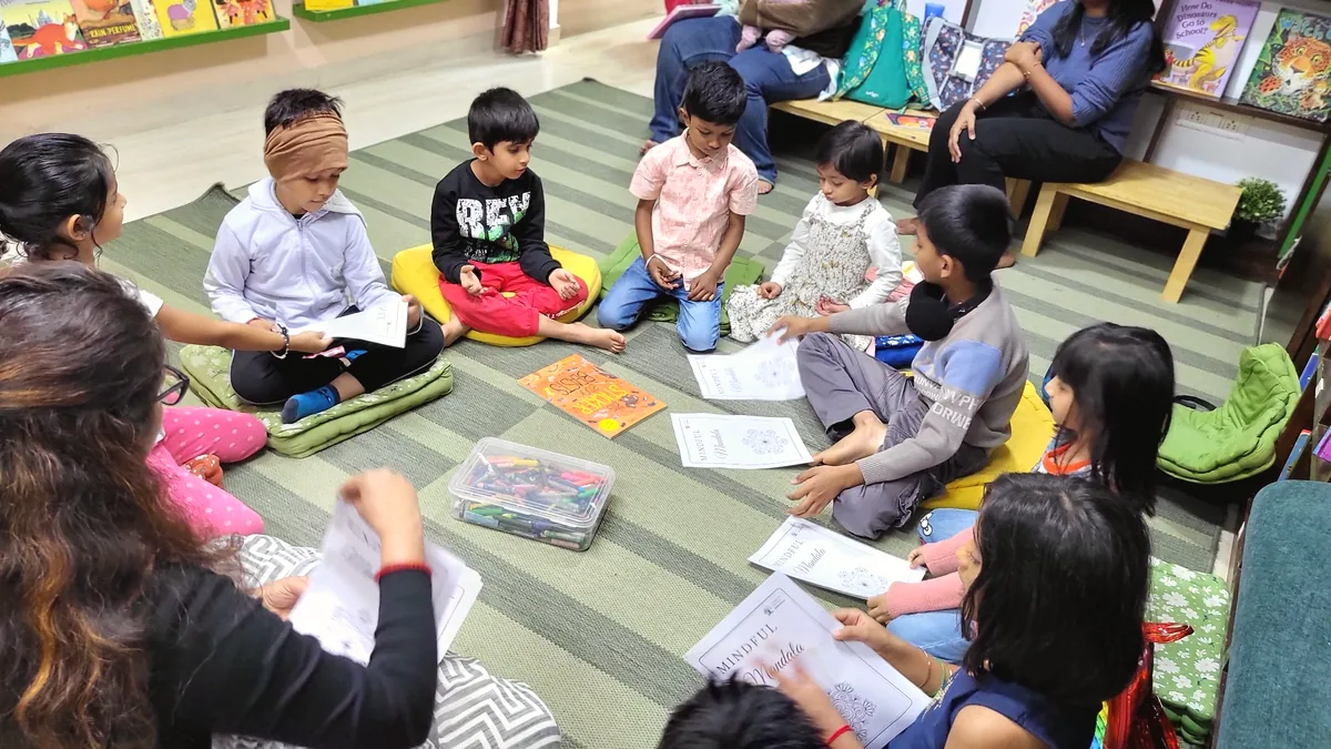 Children seated in a mindful reading circle at BOB