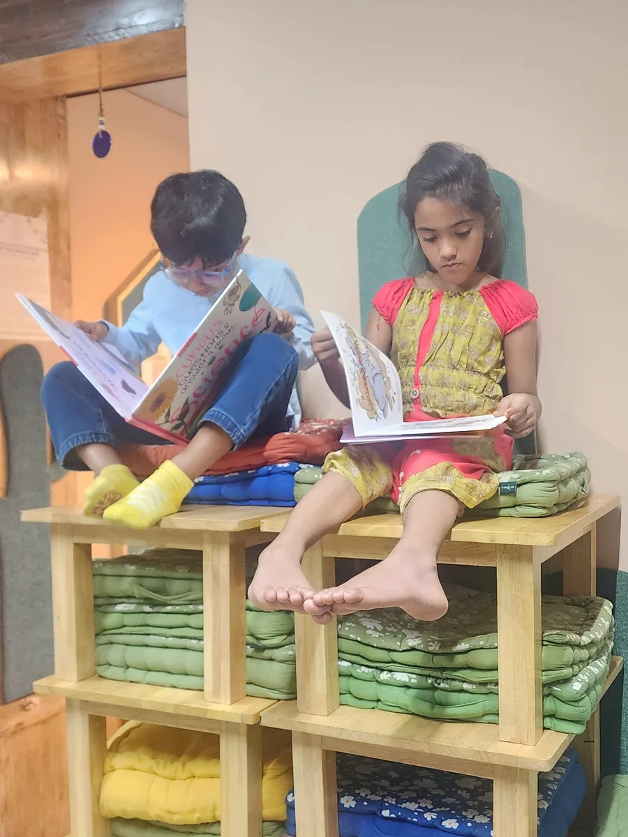 Children reading quietly in the BOB reading nook